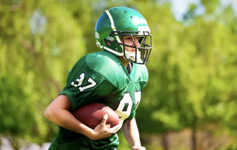 Young man playing football